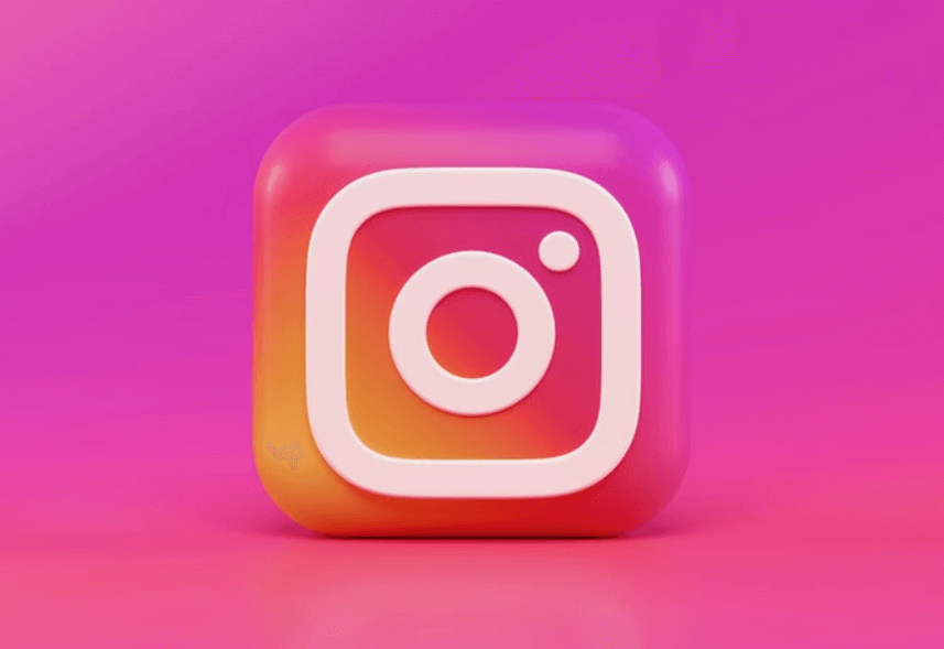 dicas de instagram: imagem do ícone do instagram no meio e o plano de fundo na cor rosa