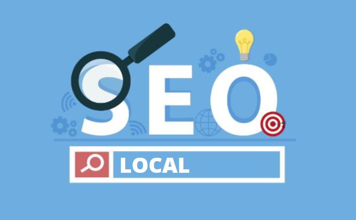 SEO Local: imagem com fundo azul escrito SEO Local em branco e uma lupa desenhada